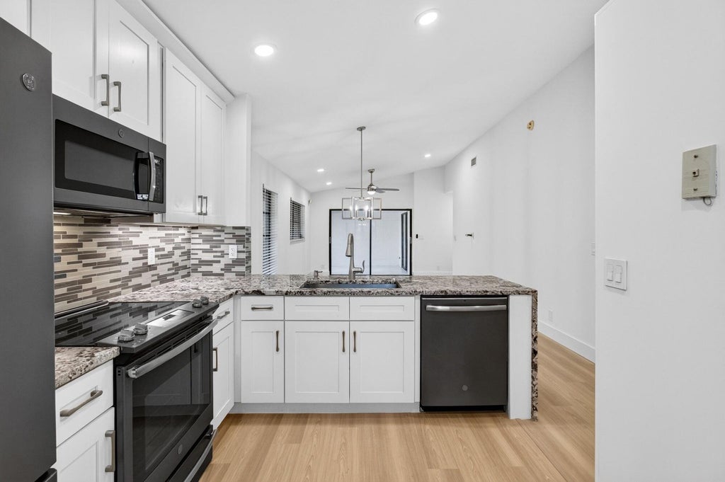 Photo of 6235 Kings Gate Circle, Delray Beach, FL 33484 (MLS # B26090802)