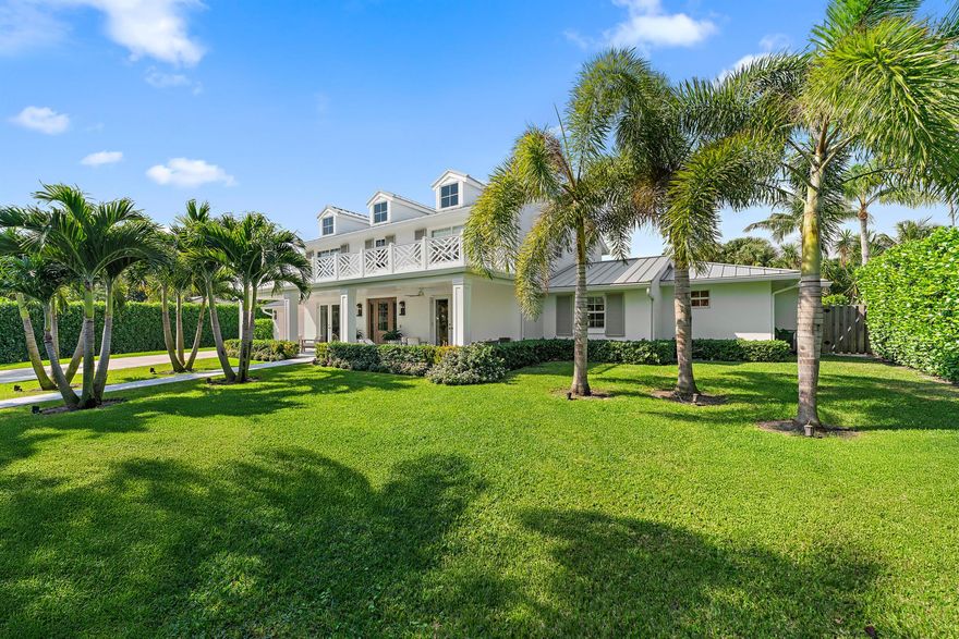 EXQUISITE Fully + Masterfully Renovated Home on 1/2 Acre in Juno Beach!  Captains Key offers a prime East of US 1 location, in a Private gated enclave of 26 custom homes.  This Impeccable residence has been thoughtfully curated to elevate the Florida lifestyle, beautifully blending indoor + outdoor living. Interior design elements fuse sophistication with comfort + highest level functionality. Every room has been hard wired for internet.  Custom wood flooring throughout.  The 2024 Chef's kitchen is spacious and features an oversized Sub Zero, quartz island, wine fridge + (natural) gas range. The spacious living area is graced by oversized picture windows + french doors leading to an extended covered lanai and HUGE backyard Oasis. A wide hallway leads to the ultra private Primary bedroom