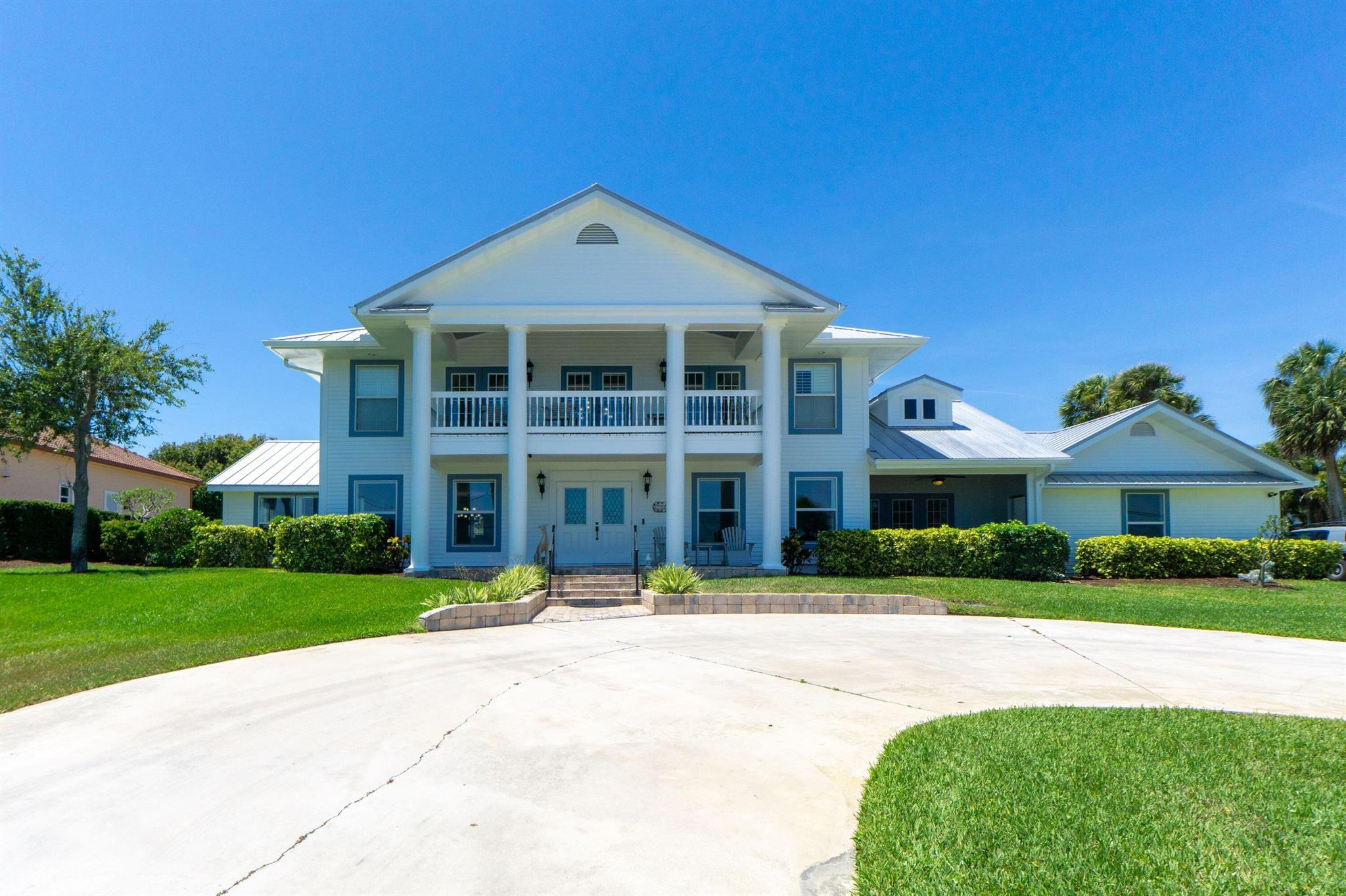 This beautiful Colonial home has 160' feet of wide River views and can be used as a multi-generational home which has two master suites. The 2nd story master has east and west balcony views. All bedrooms, family room and formal living rooms have wide river views and plantation shutters. The 350' Private DOCK has double pole 50 amp breaker, Water and Lights. The west balcony offers views of curated exotic palms from Cuba, Central America, mangos, avocados trees and the Savannas.River views are abundant from all areas of the house and yard. This house has the views of one of the most beautifully landscaped properties on the drive. Negotiated seller concessions to $35,000 towards buyers' closing costs.