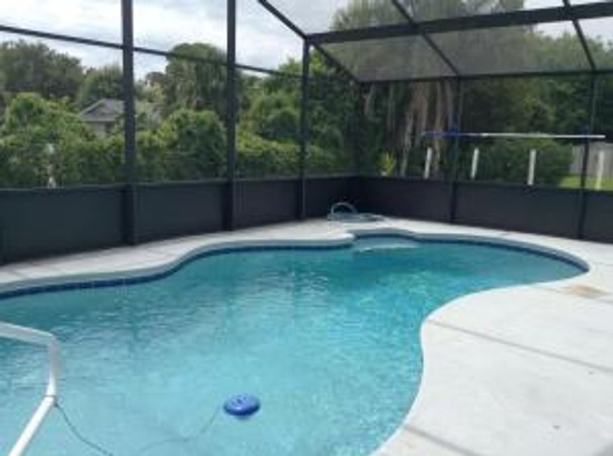 Tastefully remodeled.Freshly painted. New flooring  bedrooms In ground pool, new pumps. New Pool Screen  enclosureNew hook up to city water.New Hurricane Shutters.Beautifully landscaped. Quaint desirable location peaceful.