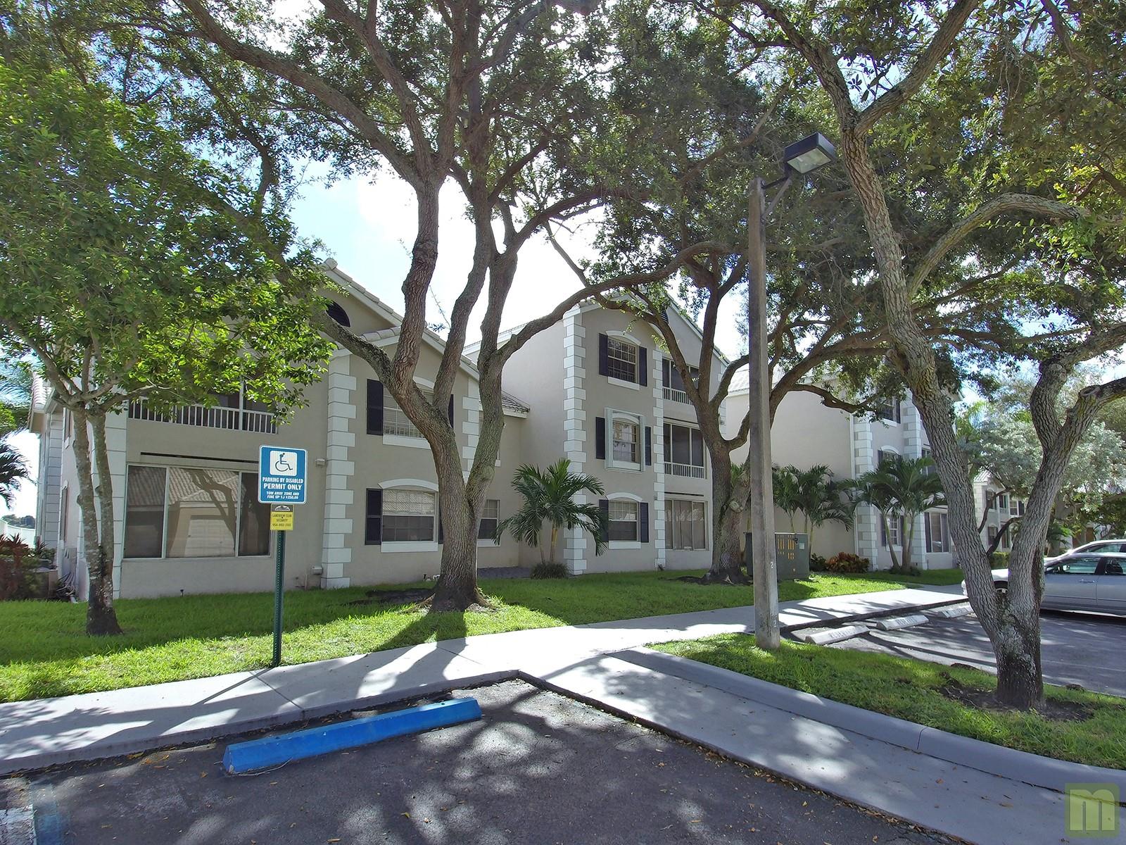 AVAILABLE NOV 1, 2025 -- Gorgeous 2nd-floor lakefront 2/2 condo in Lakeview Club of Oakland Forest. One of best unit locations - just steps to the pool and clubhouse. Spacious, open layout with vaulted ceilings, beautiful laminate wood-finish flooring, roomy kitchen with granite countertops, stainless steel appliances, breakfast bar, large bedrooms, walk-in closets, plus your own washer/dryer. A private, screened-in balcony awaits your morning coffee or evening relaxing with beautiful full views of Veteran's Lake. Plenty of parking, convenient location, close to shopping, restaurants and just minutes fromWilton Manors nightlife. Pets up to 20 lbs are welcome with a pet deposit. Assoc requires Equifax score of 620 or higher and approval before occupancy. First, Last & Security