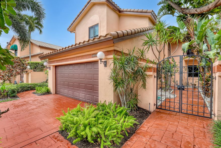 Beautifully remodeled and impeccably maintained, this stunning 4-bedroom, 3-bathroom residence is nestled within the exclusive, guard-gated Villa Flora community of Boca Pointe. This two-story home delivers the perfect blend of sophistication, comfort, and South Florida lifestyle. The heart of the home is a sleek, designer kitchen featuring glossy white cabinetry, an oversized waterfall island, high-end appliances, and custom built-ins, a true chef's dream. An open-concept floor plan flows seamlessly into the dining and living areas, creating a bright and airy atmosphere beneath soaring ceilings and clean architectural lines.   Upstairs, each bedroom boasts its own private balcony, offering serene views and the ultimate indoor-outdoor living experience. The primary suite is a peaceful retreat featuring two walk-in closets, while the additional bedrooms offer generous space and flexibility for family or guests.  Step outside to your own private oasis, a sparkling private pool surrounded by expansive outdoor entertaining spaces, built in barbecue perfect for hosting or simply unwinding. Located in one of Boca Raton's most sought-after gated communities, residents enjoy the security and prestige of Villa Flora while being minutes from world-class dining, upscale shopping, beautiful beaches, and top-rated schools.