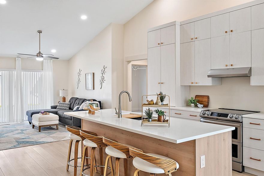 2025 BRAND NEW ROOF AND FULLY RENOVATED! Meticulously curated 2 bedroom plus den, 2 bath, 1 car garage home features a newly renovated kitchen, quartz countertops and custom stacked cabinetry, 8-foot island equipped with a brand new Kraus Workstation sink, Moen motion sensor faucet, all new appliances, double oven, soft-close doors and drawers, a coffee station or additional appliance storage. This charming residence offers two spacious bedrooms and an additional room ideal for a study. The master bath is designed with a large 6-foot shower, built-in bench, and niche, tiled in stunning 3'x5' porcelain and natural polished limestone in a herringbone pattern. A contemporary vanity, New Toto soft-close toilet, and backlit mirrors with adjustable LED lighting .