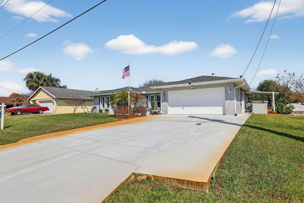 Photo of 2477 SW Chestnut Lane, Port Saint Lucie, FL 34953 (MLS # R11167075)