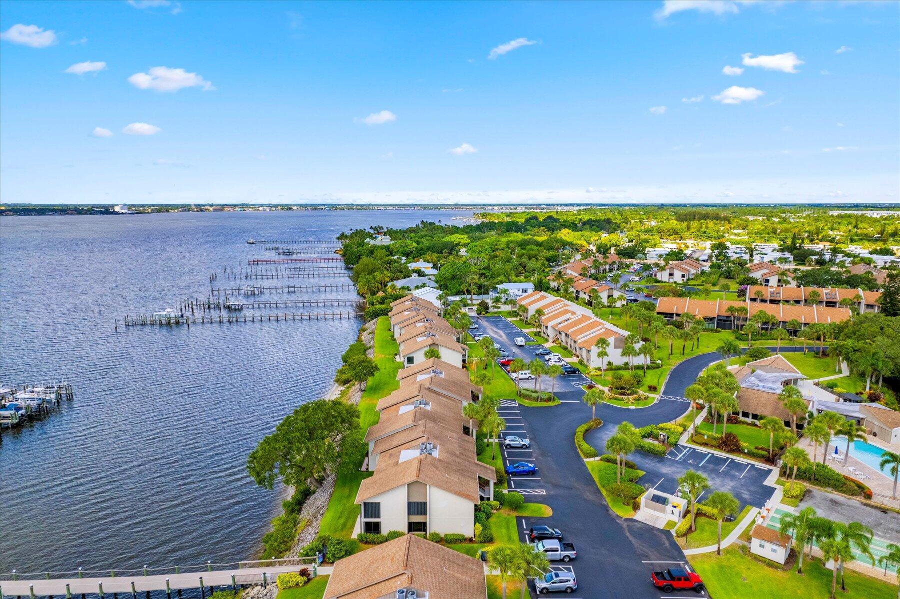 Discover this immaculate, light and bright, spacious 2/2 condo in the desirable River Club community, offering peek-a-boo views of the St. Lucie River from the living room and primary bedroom. One year new Air Conditioner. Enjoy luxury furniture included, refinished knockdown ceilings, and the convenience of an in-unit washer & dryer. Relax on the screened balcony with storage, and feel secure with accordion shutters. The River Club community features a marina on the wide St. Lucie River and is ideally located just 5 minutes from Indian Riverside Park and less than 8 minutes from downtown Stuart and downtown Jensen Beach, offering easy access to shopping, dining, and medical facilities.
