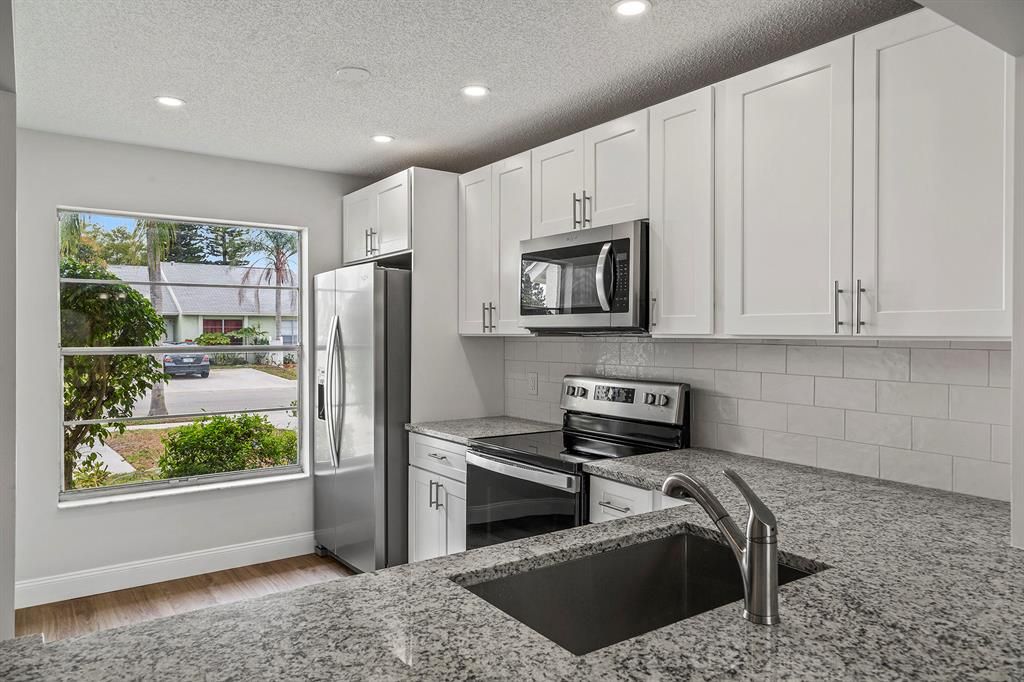 Photo of 124 Oakwood Drive, Jupiter, FL 33458 (MLS # R10699656)