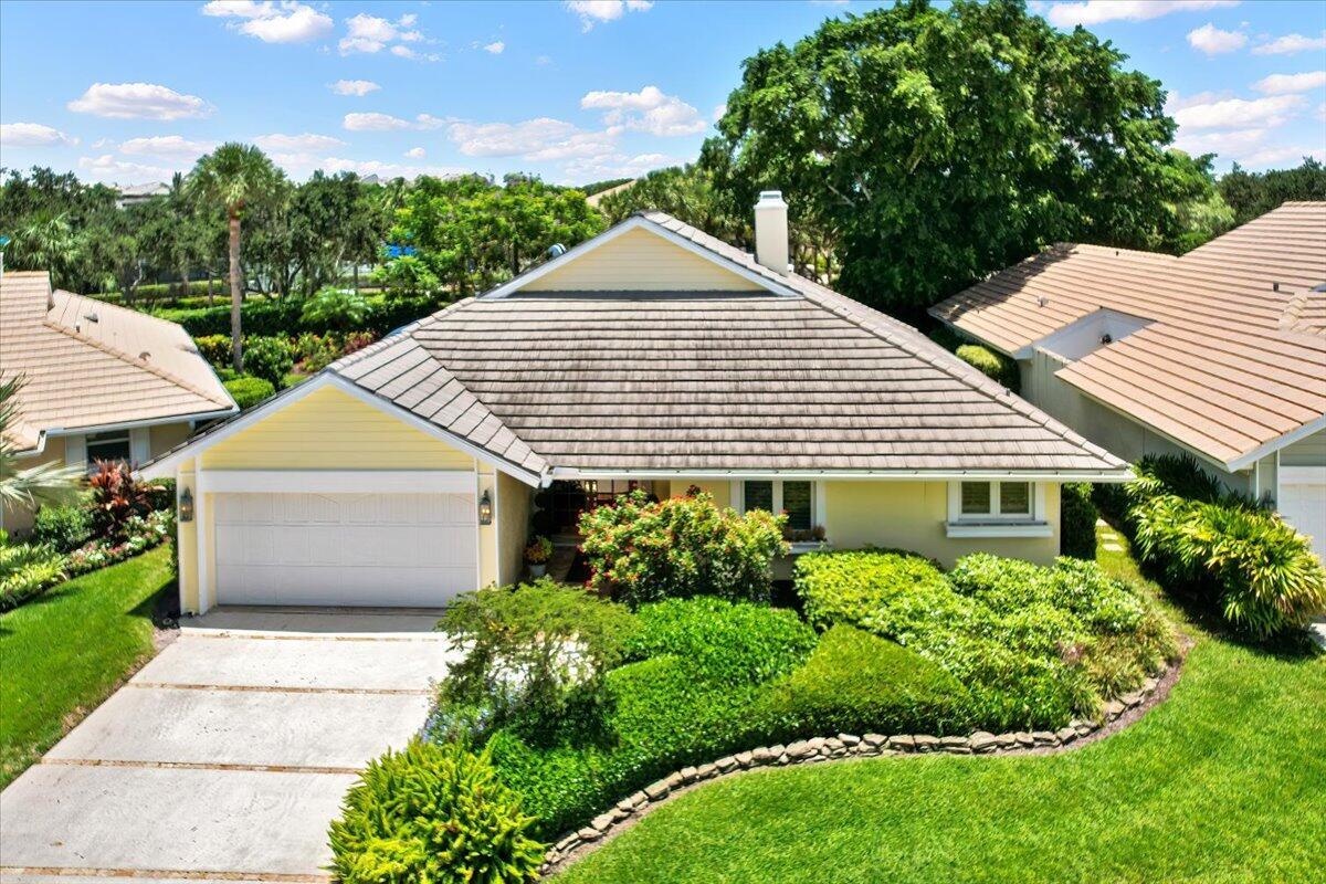 Discover your dream home in the sought-after Crosswind community of prestigious Jonathan's Landing! This 2-bedroom, 2.5-bath residence offers a layout ideal for comfortable living and elegant entertaining. Enjoy a bright living room with charming wood burning fireplace, inviting dining area and French Doors to a tranquil screened patio, updated kitchen with newer cabinets, countertops, and appliances. The spacious primary suite features, 2 walk-in closets, ensuite bath with dual sinks and walk in shower and French Doors to the screened patio. The guest suite offers a full bath and dressing area ideal for family or guests. The versatile den, built-in dry bar can easily convert back to a closet for a third bedroom! Relax or entertain on the screened porch with garden view and water feature