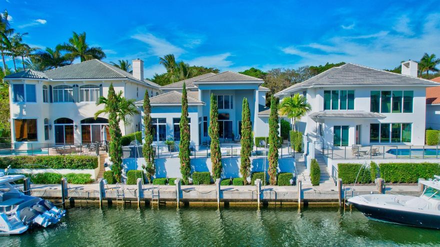 Nested in the exclusive Boca Marina Yacht Club, this east exposure waterfront estate offers long water views and 57 feet of private dockage on the canal with direct ocean access. This modern designer decorated residence features five generously sized bedroom suites including the master and office suites on the first floor, high ceilings, chef's kitchen with Thermador/Miele appliances and wet bar entertainment area. Alfresco outdoor kitchen, heated saltwater pool and cabana bath make this property perfect for Florida living and work. Equipped with manned gate, interior and exterior security system and cameras, hurricane windows and doors, Control 4 smart home system. Perfect location with access to best schools restaurants, entertainment, and country clubs.