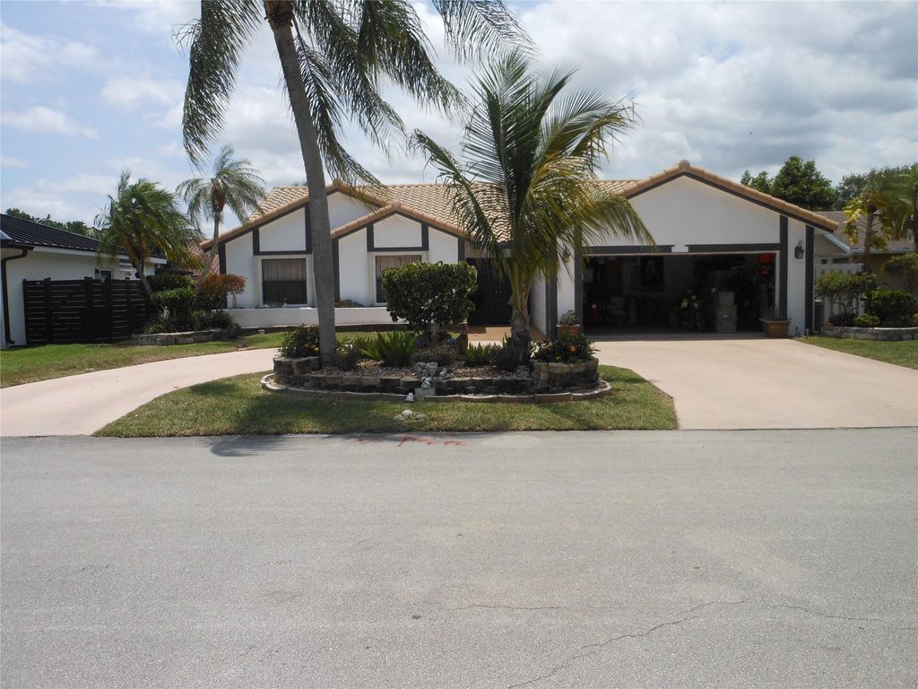 Photo of 8706 NW 83rd Street, Tamarac, FL 33321 (MLS # B26038293)
