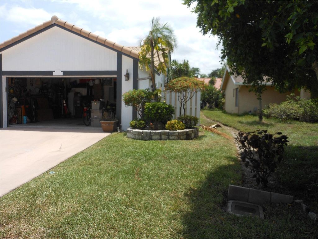 Photo of 8706 NW 83rd Street, Tamarac, FL 33321 (MLS # B26038293)
