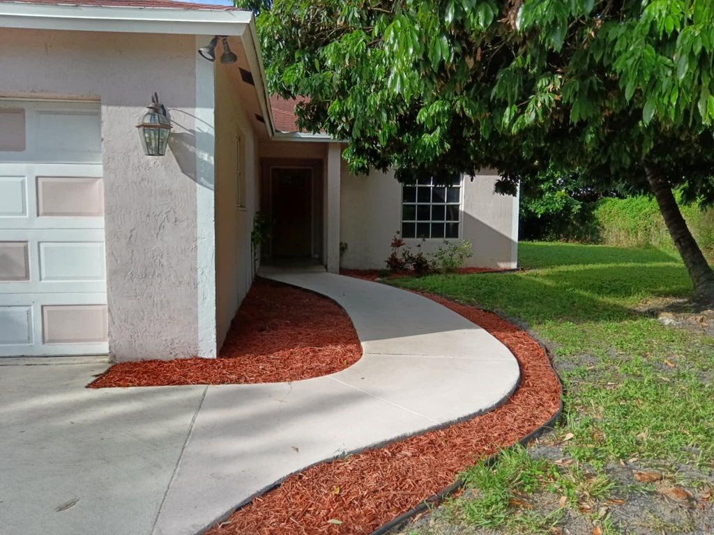 Photo of 1704 Boardman Avenue, Mangonia Park, FL 33407 (MLS # R11144043)