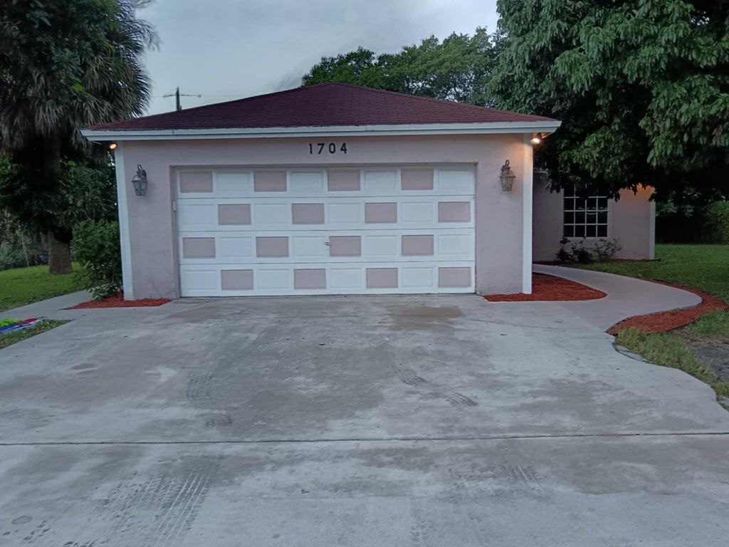 Photo of 1704 Boardman Avenue, Mangonia Park, FL 33407 (MLS # R11144043)