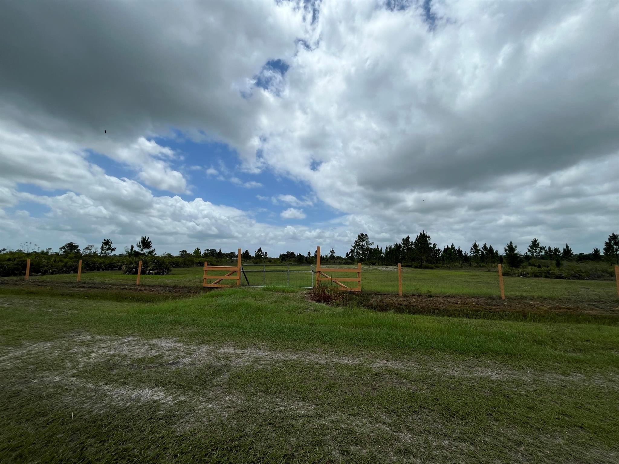 Build or bring your dream home on this spacious 1.5-acre lot. Property is already fenced with a gate in the front and culvert in place. House pad and a retention pond is on the property making it ready to build. The seller has invested over $18,000 in fill. Survey is done and available. Not far off the paved road. Residents can enjoy the privacy of a rural setting while still being close to essential amenities. The area is a haven for outdoor enthusiasts, boasting attractions like the Kissimmee River Preserve State Park and the expansive Lake Okeechobee, famous for its excellent fishing opportunities. Whether it's fishing, hunting, agriculture, or simply a desire for privacy, Okeechobee County provides an idyllic backdrop to create a personalized retreat.