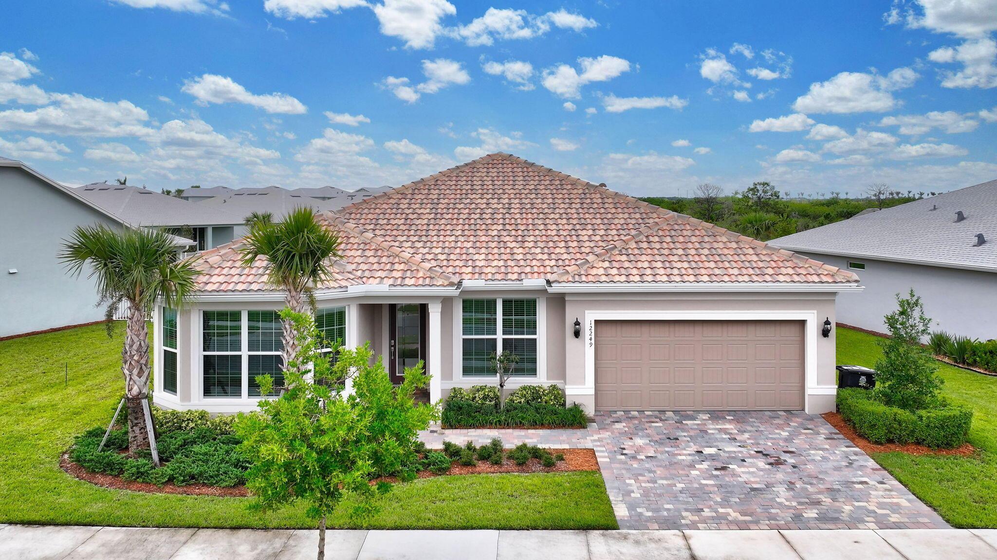 HUGE 5bed/3.5bath home built in 2024! TILE ROOF, Hurricane resistant windows & doors, CBS Construction. This stunning Estate lot home offers 2,951 sqft of beautifully designed living space. Plenty of room for the entire family to spread out and enjoy. One of only a few homes in Heron Preserve w/a TILE ROOF. Over $130k in upgrades, no detail has been overlooked. Gourmet kitchen with walk-in pantry, upgraded flooring and countertops, custom window treatments, pocket sliders and oversized patio. Thoughtfully designed for comfort and privacy, primary bedroom with luxurious en suite bathroom and enormous walk-in closet. En suite guest bedroom perfect for in-laws, nanny, or guests. Minutes from Tradition's vibrant downtown, parks, restaurants, shopping, and easy access to​​‌​​​​‌​‌​​​‌‌​​​‌‌‌​​‌​​‌‌​​​​ I-95.