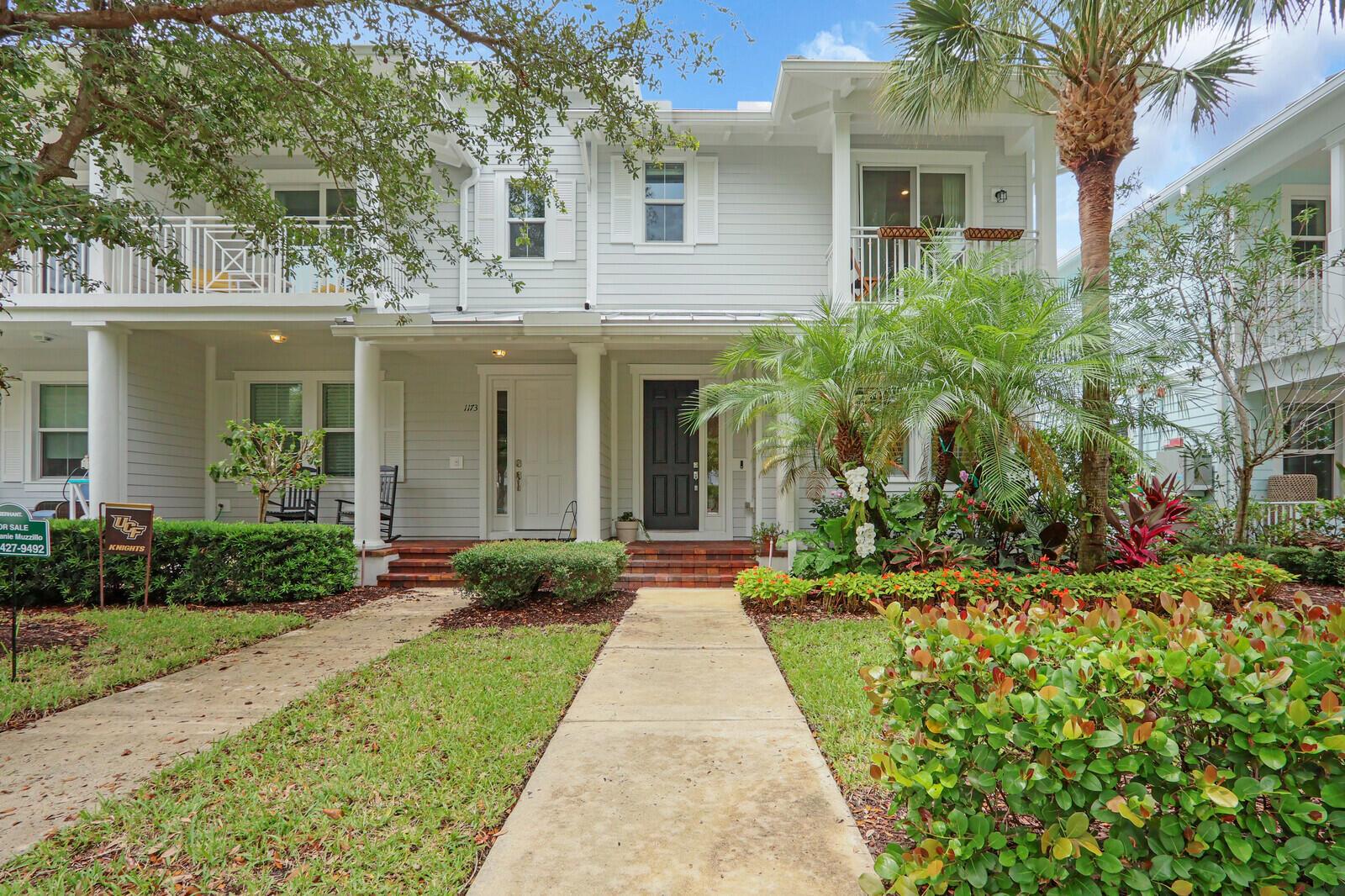 Beautifully upgraded, corner townhome in highly desirable Abacoa Windsor Park community boasting a coastal-vibe, remodeled guest bathroom with deep soaker tub, remodeled under stairwell converted to office with counter space and filing system drawers separated by beautiful sliding glass door, additional storage space with door passage under stairwell, crown molding and high baseboard throughout living area, plantations shutters, light wood vinyl flooring, kitchen undermount lighting, surround sound speakers and wiring, insta-hot tankless water heater in garage for space and energy conservation, plus additional recess and accent lighting in living room. Ceiling fans in all rooms, wire storage racks in garage, and wired for security.