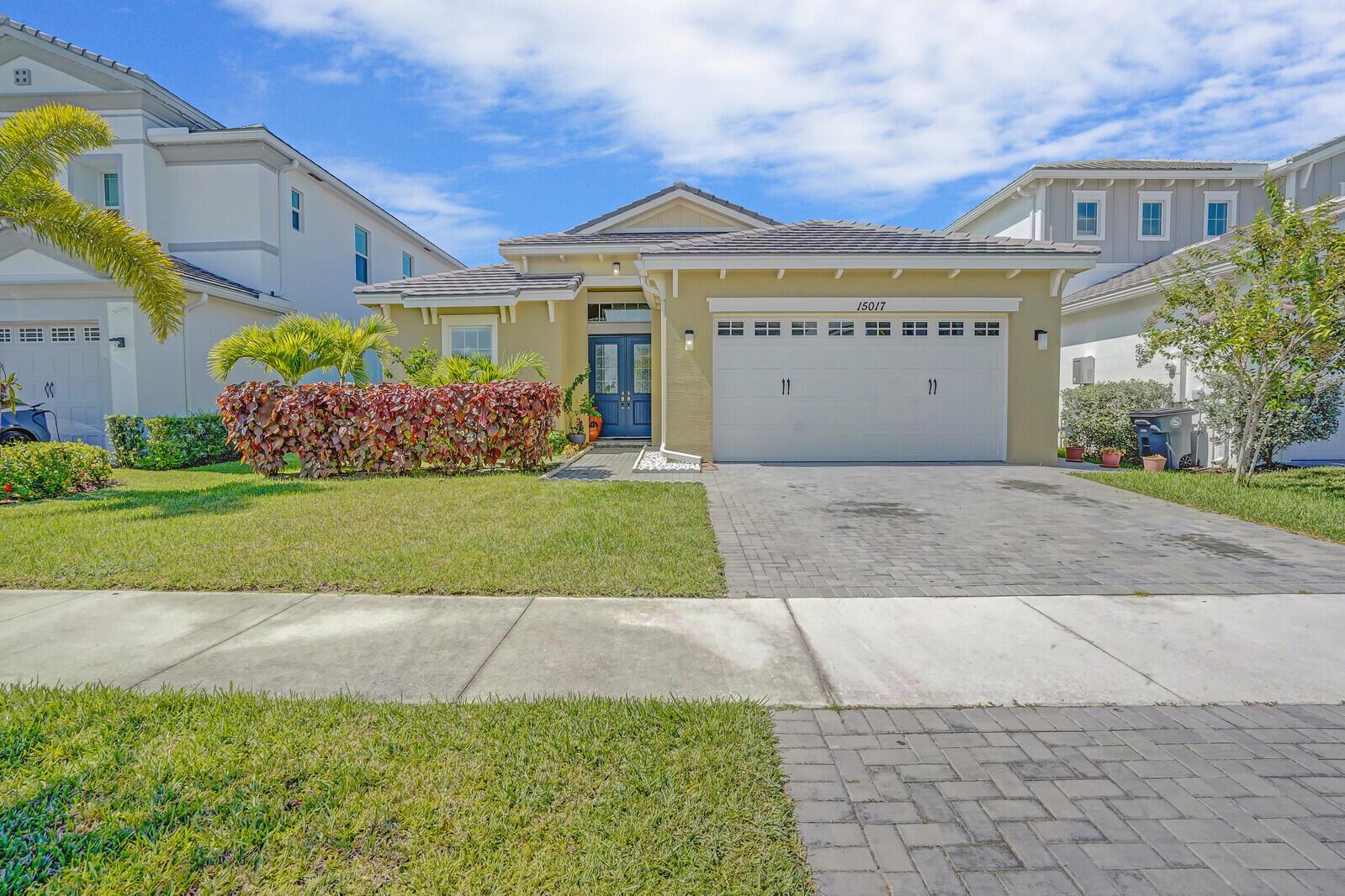 Beautifully upgraded 3 bed, 3 bath waterfront home in the desirable Orchards of Westlake. A rare built-out kitchen extension adds exceptional space and functionality, perfect for cooking and entertaining. Enjoy serene lake views from the expansive screened-in patio, designed for year-round indoor/outdoor living. Please note that the owners built-out the second kitchen after the home was built in 2024. These bonus living sqft are not included in the sqft total. Beautiful addition to the home.Residents of Westlake enjoy resort-style amenities including a lagoon pool, splash park, playgrounds, sports courts, and walking trails. This home offers the perfect blend of comfort, lifestyle, and location within Palm Beach County's newest city.