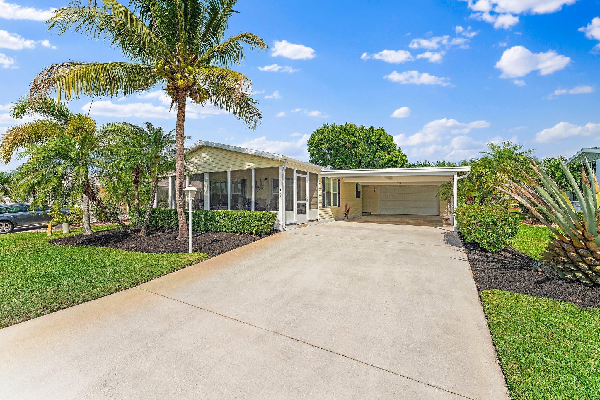 Welcome to Florida retirement in this beautiful Islander III model. Home is fully furnished and features 2 BR's, 2 BA's, and an additional den/office, or 3rd BR w/ French doors. The heart of the home is updated with a modern styled kitchen, adorned with quartz countertops and SS appliances. Primary bath has updated cabinetry, countertops, dual sinks and additional storage. Home has a 2020 roof and a 2-car gar. along with an oversized covered carport, cost saver irrigation well with updated hurricane anchors. Step out and unwind on the 27'' screened lanai or enjoy the outdoor patio with lake views. This home has it all and located in the amenity packed 55+ Savanna Club community. Land Lease Property. All measurements approximate, buyer to verify