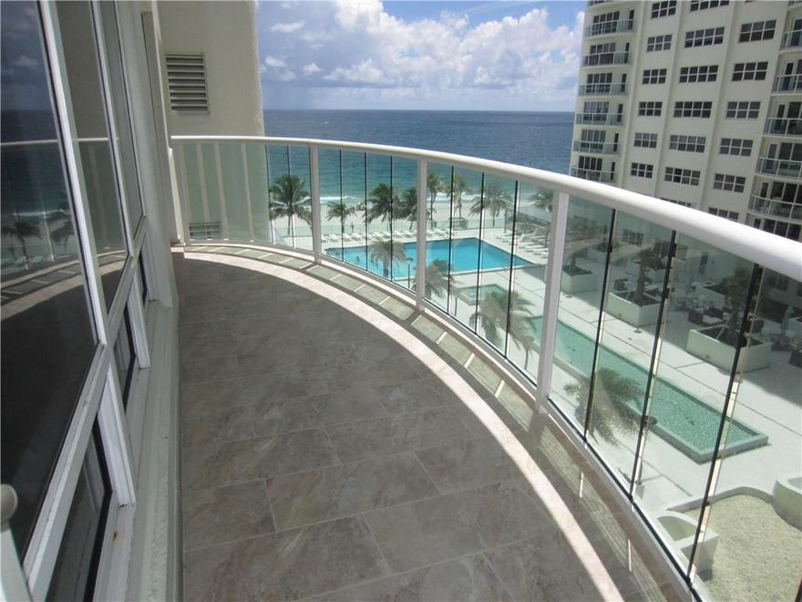 Totally renovated 2 bedroom two bath furnished condo with beautiful ocean and pool views set right on the beach. Facing south/southeast, this is a sunny, bright apartment. The kitchen is open and features new high end appliances. Unit has a full size washer/dryer. The 2nd bedroom is divided into two rooms and easily sleeps 3 people with privacy.  The master bedroom is roomy with a California style closet. Amenities include gyms & 24/7 security. Underground parking for your car & plenty of guest parking.
