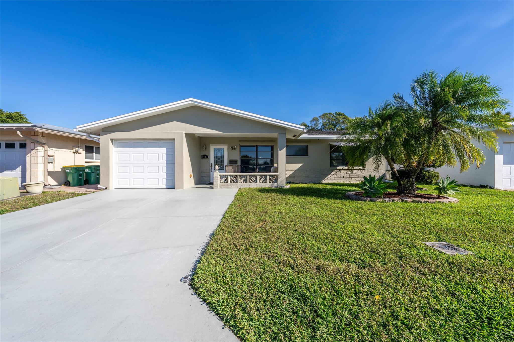 Discover this beautifully renovated 2-bedroom, 2-bath home in the desirable Mainlands of Tamarac Section 3, a vibrant 55+ community. This captivating residence features a spacious Florida room with stunning lake and park views and direct access to a scenic walkway, perfect for peaceful mornings or evening strolls. The updated kitchen boasts newer appliances, blending style and functionality. Enjoy outdoor living on the backyard patio, ideal for relaxing or entertaining. With a 1-car garage offering extra storage, and driveway for 2 cars, this home provides comfort, convenience, and a serene setting. Located near shopping, dining, and major highways, it’s the perfect place to enjoy South Florida living.