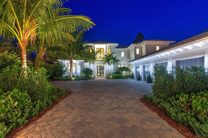 Palatial custom built coastal style  waterfront estate home in the prestigious Golfing and Boating community of Admirals Cove. This stunning 8985 sq ft home built by BeachLen features 6 bedrooms 7.2 baths a flex room with wet bar boasts top of the line everything. Open Chef's kitchen with 2 island food prep station, custom cabinets, Thermadore appliances, marble floors that are all open to fabulous family room. Grand master suite with lavish marble bath, and awesome waterway views. Open and bright family room stunning gas fire place that open to spectacular summer kitchen for hours of enjoyment. Impact windows and doors, 4 car garage, resort style infinity edge pool & patio, protected dock for large yacht.  This home has architectural flair with tons of unique touches.
