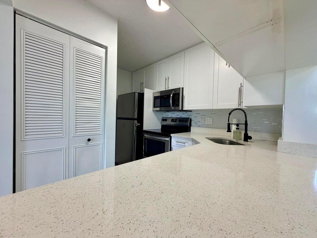 Photo of 616 Sea Pine Way #C3, Greenacres, FL 33415 (MLS # B26046538)