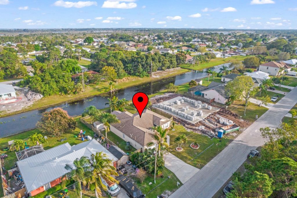 Photo of 2317 SE Rock Springs Drive, Port Saint Lucie, FL 34952 (MLS # R11080597)