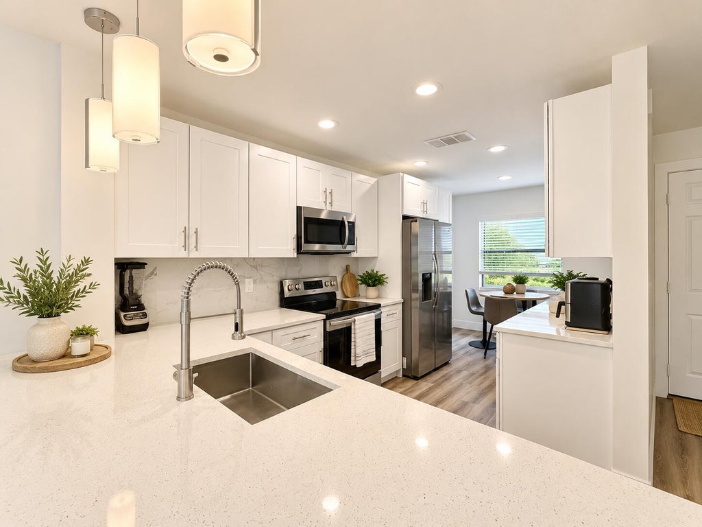 Photo of 30 Southport Lane #D, Boynton Beach, FL 33436 (MLS # B26084296)