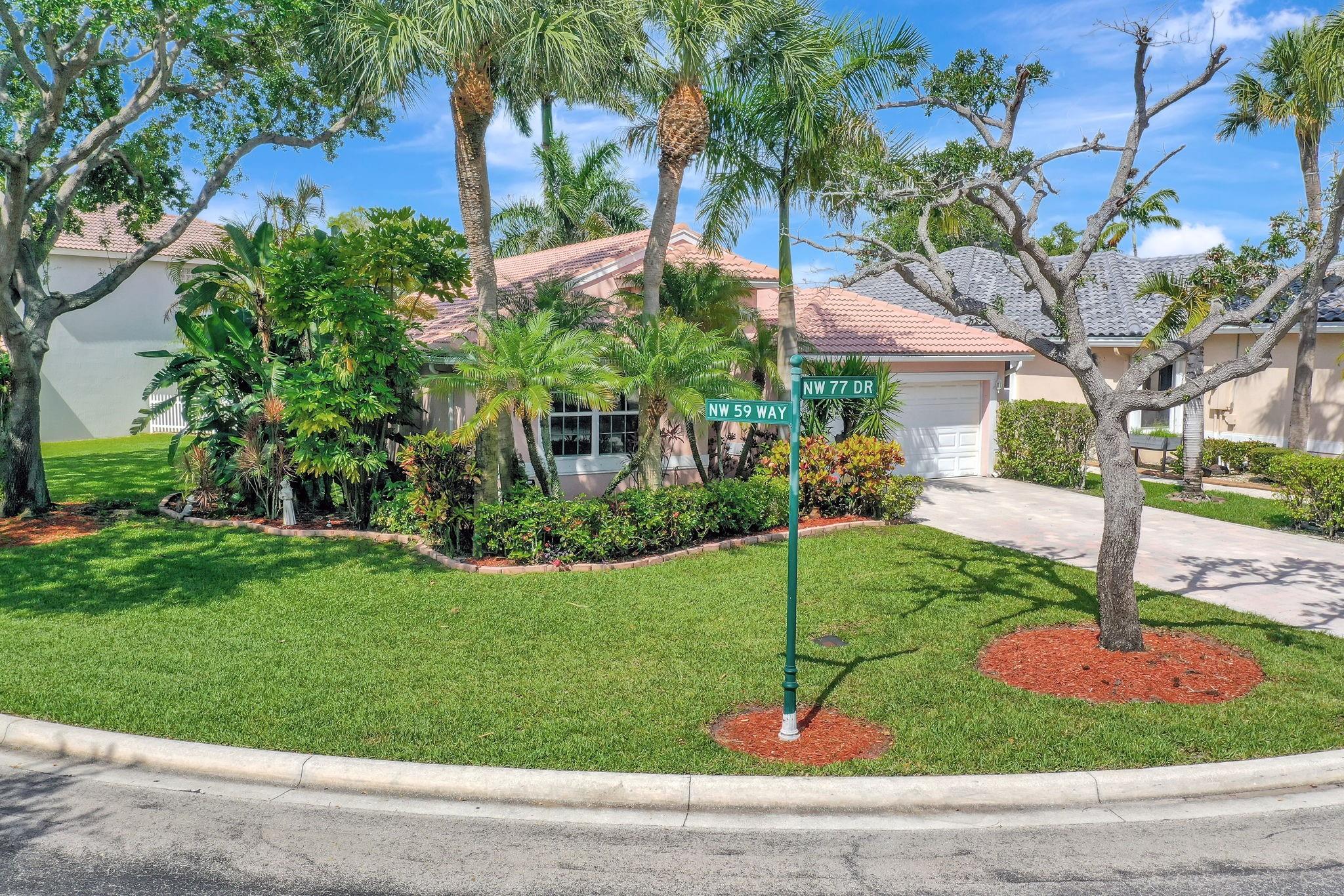 LOWEST PRICED HOME IN PARKLAND! This charming 3-bedroom, 2-bath single-story home offers beautiful lake views and a spacious, light-filled interior. Key features include an expansive kitchen with stainless steel appliances, a split bedroom layout with a primary suite featuring his and her closets, and two additional bedrooms sharing a hallway bath. The family room, featuring a tray ceiling, opens to a backyard retreat complete with a patio and a screened enclosure—perfect for relaxing and taking in the lakeside scenery. Located in eastern Parkland, the home is zoned for top-rated schools and conveniently close to highways, shopping, and dining.