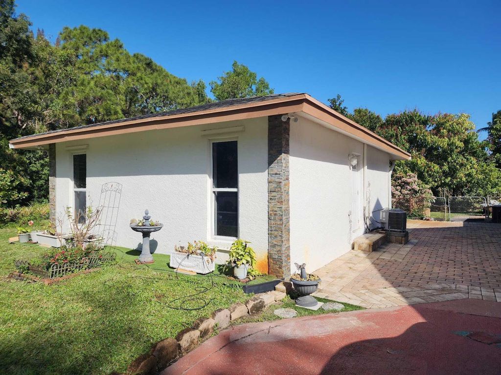 Photo of 12668 70th Pl Street N, West Palm Beach, FL 33412 (MLS # B26029085)