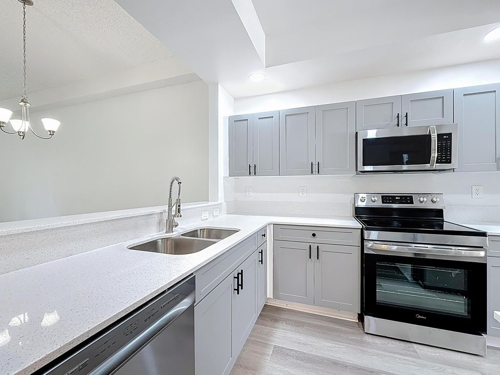 Photo of 3180 N Haverhill Road #102, West Palm Beach, FL 33417 (MLS # B26014626)