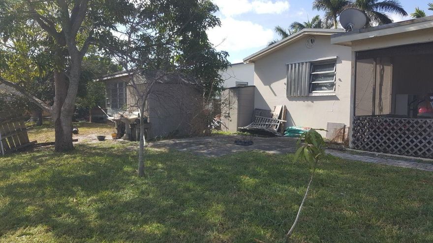 INVESTMENT IN SW HALLANDALE !!! beautiful 2 bed 2 bath on the canal.house is in perfect shape, no need to do ant repairs.tenant pays 1700 dollars  WITH A YEAR LEASE .tenant have been there for 6 years...tenant pays all utilities (water, fpl, landscaping,)owner need to pay tax and insurance