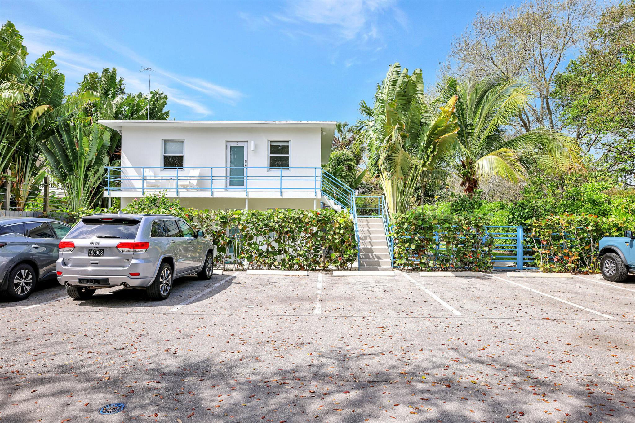 Discover a captivating Parkside Retreat - a meticulously renovated Mid-Century Fourplex, nestled within an expansive tropical oasis. Boasting two generous 2-bedroom/1-bathroom units alongside two cozy 1-bedroom/1-bathroom units, currently operating as sought-after short-term vacation rentals. Elegantly embracing the timeless charm of mid-century architecture, this property has undergone a stunning transformation. Every detail reflects a commitment to preserving the timeless charm and character of the property's mid-century design. From the tastefully updated kitchens and bathrooms to the installation of impact windows and doors, each element honors the essence of the era while seamlessly integrating modern comforts. A brand new roof has just been installed, further enhancing
