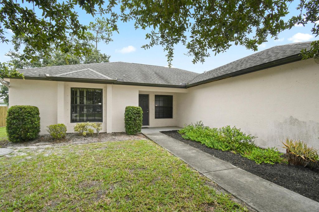 Photo of 1667 SW California Boulevard, Port Saint Lucie, FL 34953 (MLS # R11102889)
