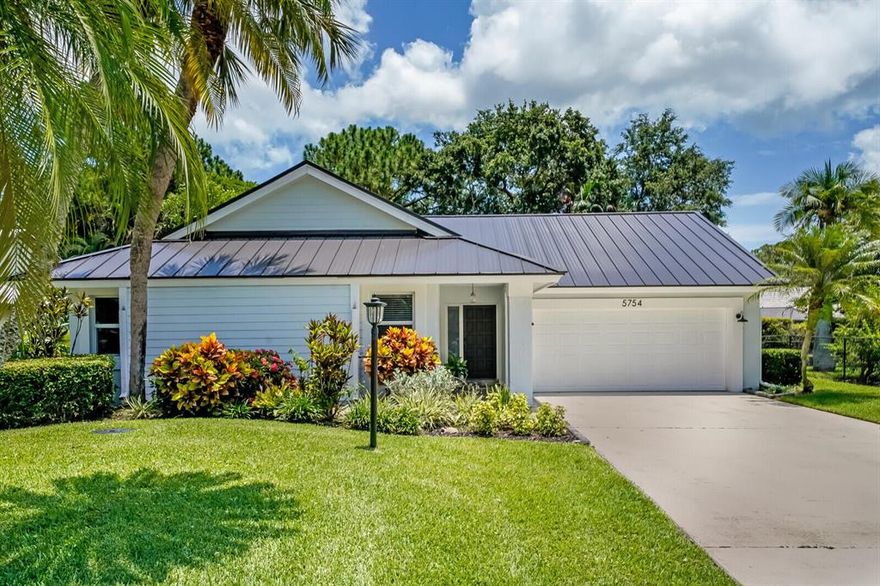 Beautiful one story home nestled in the quaint community of Woodland Estates. Located on a quiet culdesac, this home has been completely renovated, with a brand new metal roof, new gutters, new sprinkler system, new AC, whole house generator and impact windows. This home is meticulously maintained and has been spared no detail from top to bottom. Gorgeous new wood tile floors throughout, custom kitchen cabinets, quartz countertops and stainless steel appliances. Every bedroom features custom closets and tongue and groove ceilings. New doors, casings, baseboards and trim adorn this home. Both bathrooms have been updated with modern, crisp, clean finishes. Plans have already been submitted and approved for a pergola to be built in the private backyard. Zoned for Jupiter schools.