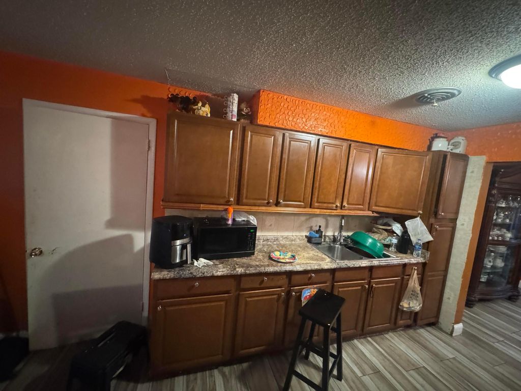 Photo of 521 E Redwood Drive, Lake Park, FL 33403 (MLS # B26011775)