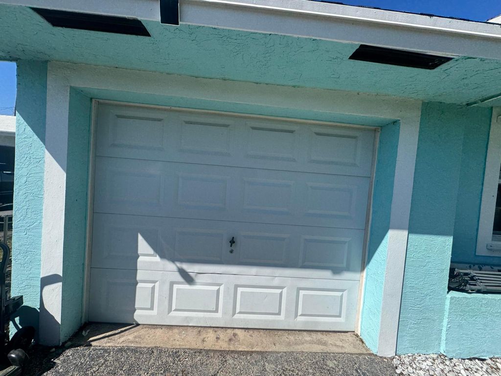 Photo of 521 E Redwood Drive, Lake Park, FL 33403 (MLS # B26011775)