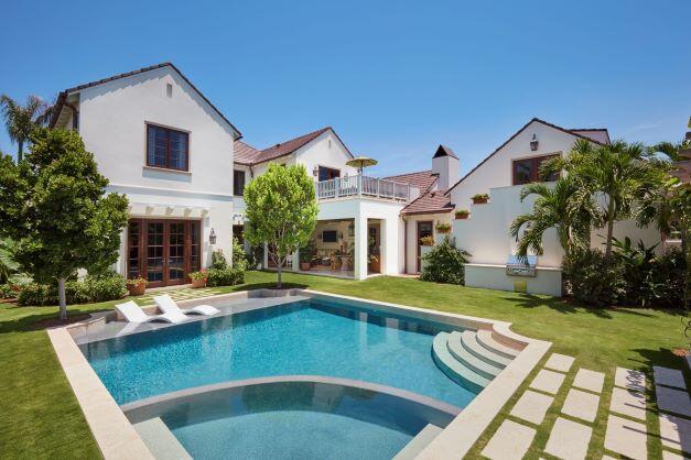 Wonderfully conceived north-end home designed by Roger P. Janssen. Spacious, yet intimate & comfortable. Lovely 1st floor Primary Bedroom Suite overlooking the garden & pool. Kitchen & Butler's Pantry with adjacent Family Room & large covered Loggia. Lush, tropical & very private gardens. Pool with sun shelf. 2 Car Garage. Generator. Separate studio/office. Path to ocean beach access at the top of Indian Road.