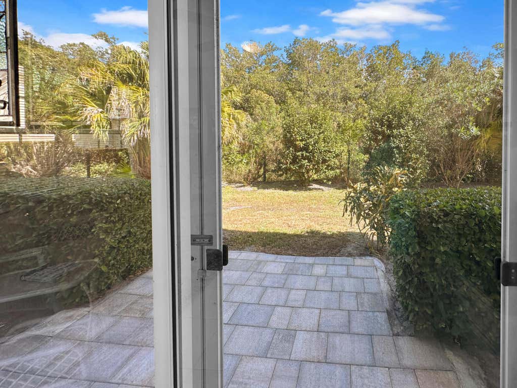 Photo of 720 Lake Orchid Circle #102, Vero Beach, FL 32962 (MLS # R11161215)