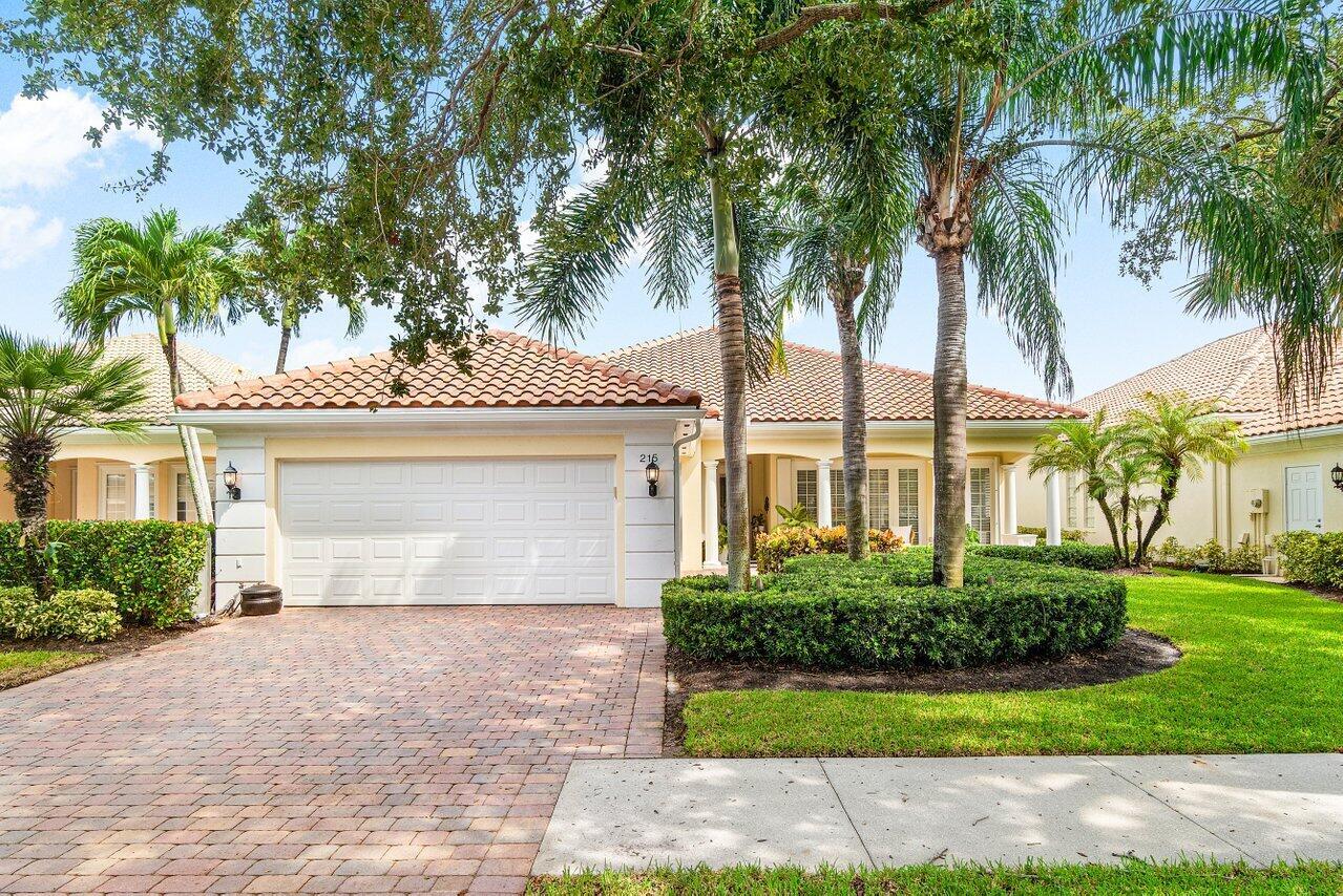 Enjoy peaceful lake views from this immaculately maintained Carlyle model, on a quiet cul-de-sac in the coveted Isles at Palm Beach Gardens. Boasting a brand new roof (Aug 2025), updated baths with marble vanities and nickel finishes and an inviting front porch, this light-filled 4BR/3BA home features formal and informal living areas, soaring ceilings, diagonal porcelain tile, and a screened-in lanai perfect for outdoor relaxation. The 4th bedroom is set up as a home office with custom built-ins. The spacious kitchen with granite counters and abundant cabinetry flows seamlessly into the family room. Large primary suite offers dual baths and generous closets. Pristine 2 car garage and laundry. Enjoy resort-style amenities including pool, tennis, pickleball, clubhouse, and fitness center.