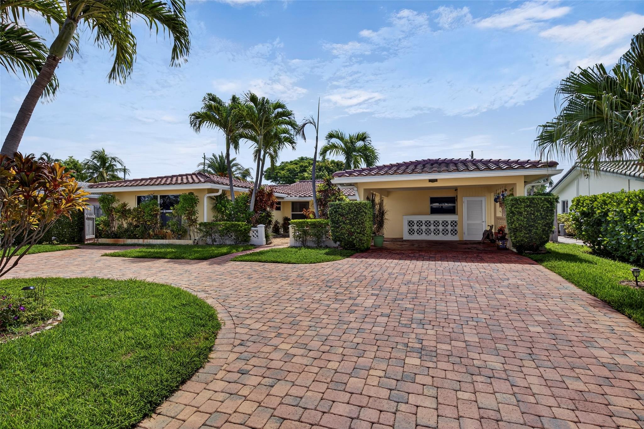 Welcome to this fabulous duplex in the highly sought-after Coral Ridge Isles neighborhood of Fort Lauderdale. A great opportunity for investors or multigenerational living, it offers two units with separate entrances. The first features two bedrooms, two bathrooms, tile floors throughout and a new washer/dryer. The second offers one bedroom, one bathroom and a convenient washer/dryer hookup. Both units are move-in ready with new stoves and refrigerators. Highlights include a newer roof, impact windows and doors, a screened-in porch and a large fenced backyard. The property also offers plenty of parking with a carport and paver circular driveway. Prime location just minutes to the beach, dining, shopping and entertainment. Great neighborhood and No HOA!
