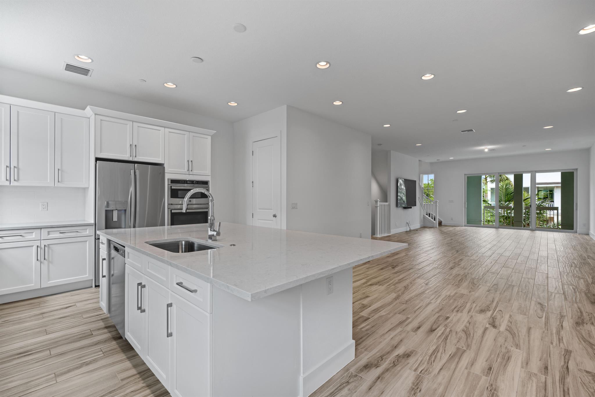 Experience luxury townhouse living in this Alton rental. Boasting 2750 square feet, this home features 3 bedrooms with a convenient ground floor den, for office or play. Built in 2022, this like-new residence includes many upgrades: such as stainless steel kitchen appliances, a generous kitchen island, and elegant porcelain tiles that emulate the warmth of natural wood throughout the main living level and first floor. Retreat to the expansive primary suite, with custom-designed shower. Enjoy privacy outside on the second and third floors balconies. The large two-car garage offers ample storage space. Enjoy the community's resort-style pool and state-of-the-art fitness center. Seize the opportunity to call this exceptional townhouse home by scheduling a viewing today.