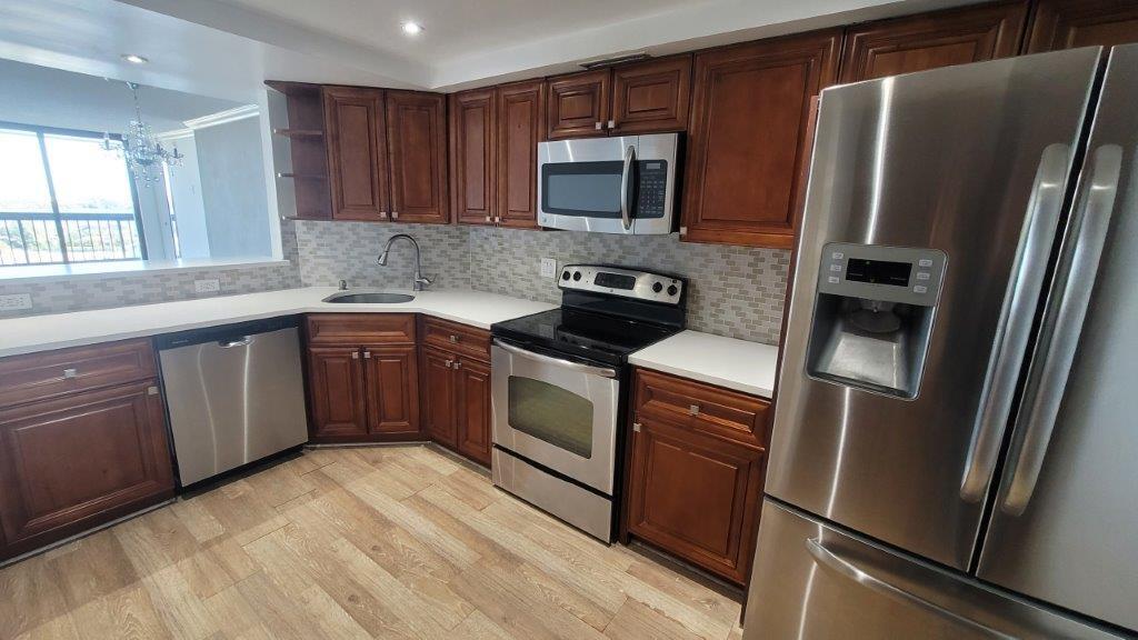 Location, Location, Location! This beautifully updated 2-bedroom, 2-bathroom apartment offers the ultimate in convenience and lifestyle. Imagine being steps from shopping, minutes from I-95, hospitals, and the vibrant downtown West Palm Beach and world-renowned Palm Beach Island. Inside, you'll find brand new floors creating a warm and inviting atmosphere, complemented by fresh paint and stylish new baseboards. This gated community features fantastic amenities, including a pool, library, gym, on-site management office, and a doorman. Don't miss this opportunity! Request more information.