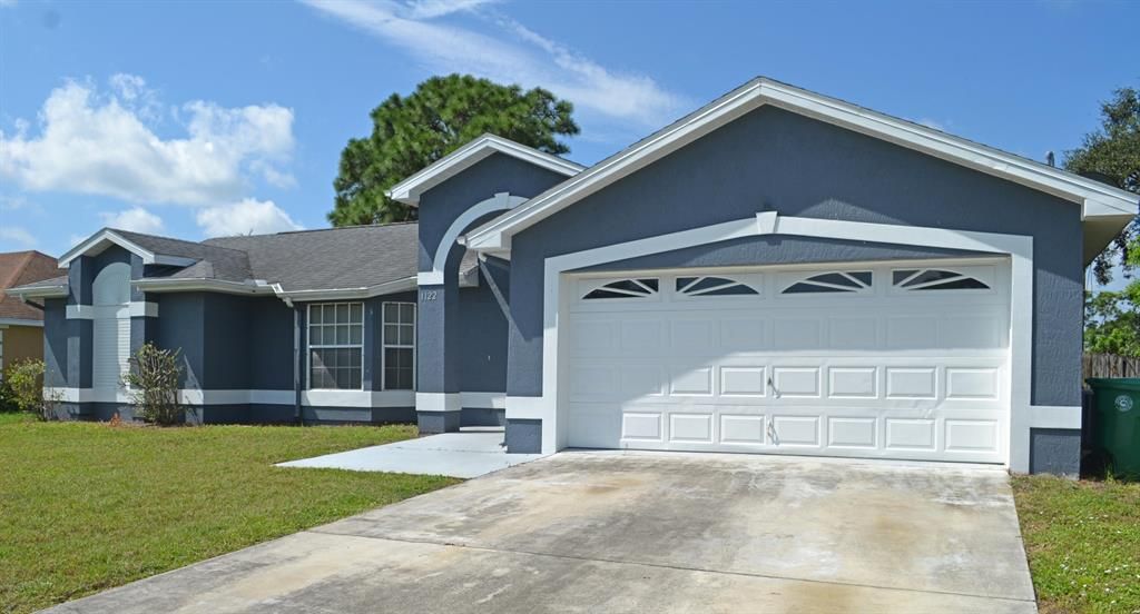 Photo of 1122 SE Puritan Lane, Port Saint Lucie, FL 34983 (MLS # R10743539)