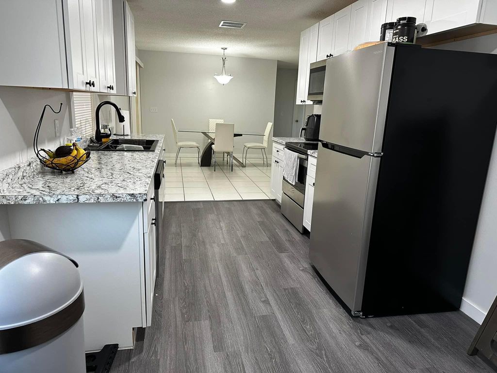 Photo of 141 SW Duval Avenue, Port Saint Lucie, FL 34983 (MLS # R11071314)