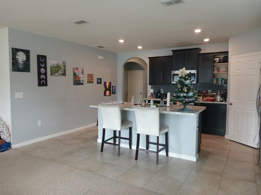 Photo of 494 SW Dairy Road, Port Saint Lucie, FL 34953 (MLS # R10948531)