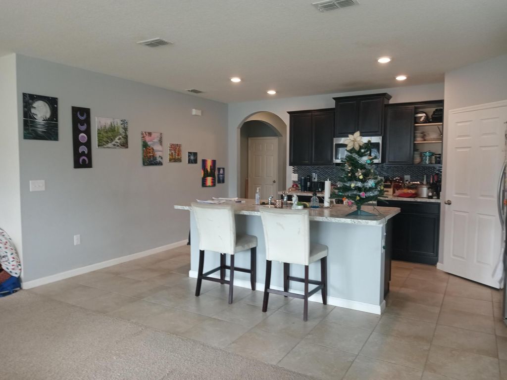 Photo of 494 SW Dairy Road, Port Saint Lucie, FL 34953 (MLS # R10948531)