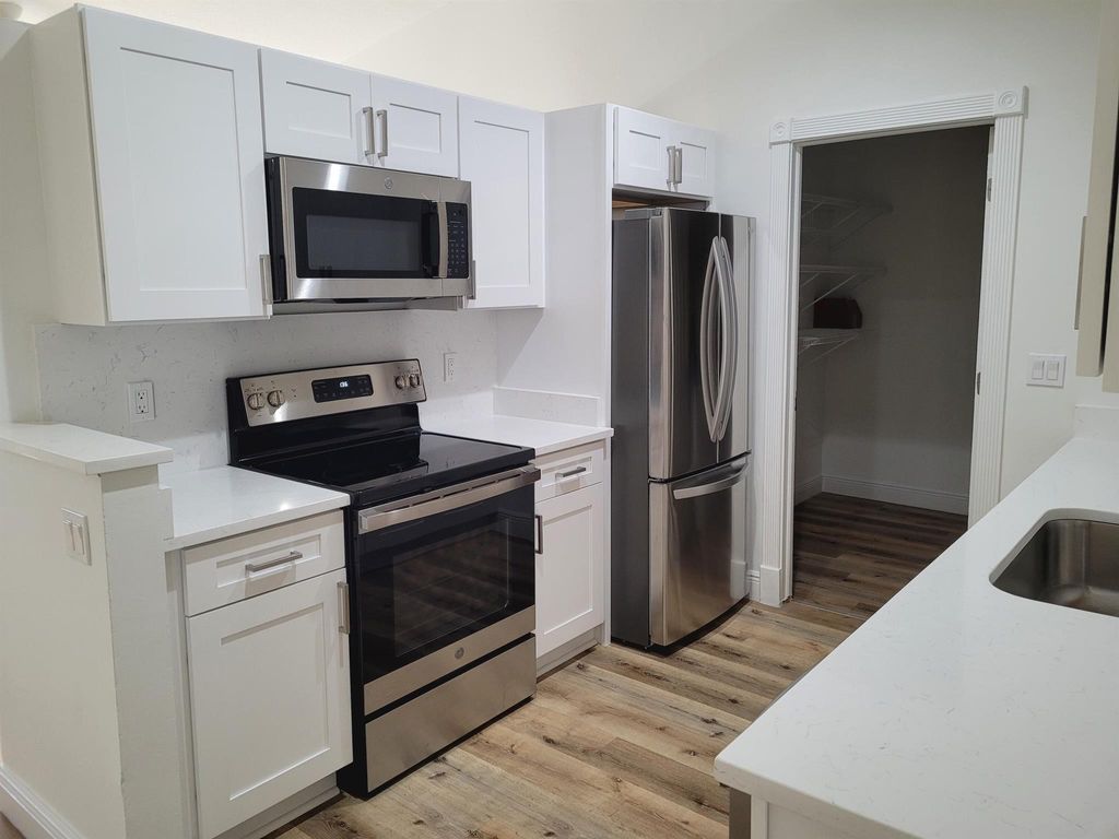 Photo of 2911 SW Lucerne Street, Port Saint Lucie, FL 34953 (MLS # R10969191)