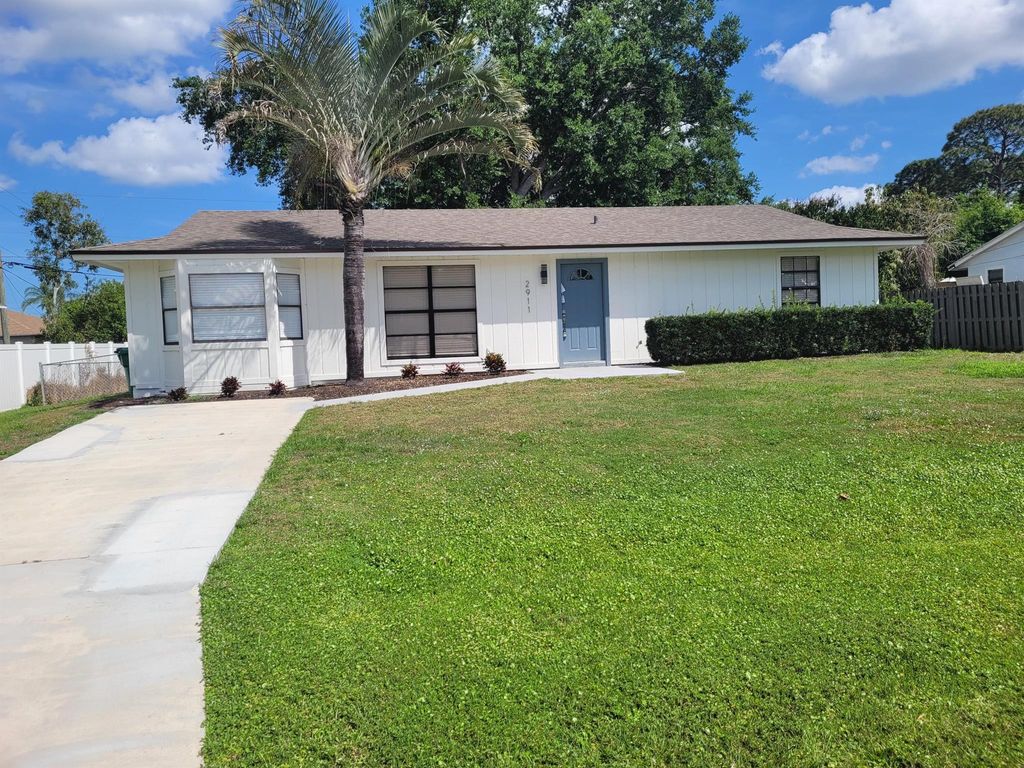Photo of 2911 SW Lucerne Street, Port Saint Lucie, FL 34953 (MLS # R10969191)