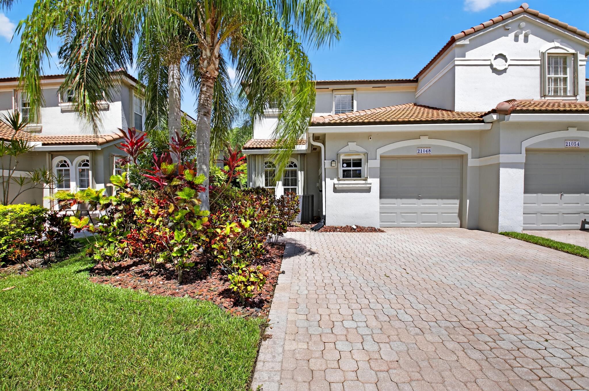 Nestled within the gated community of Mizner Pointe you will find this exceptional end unit townhome featuring 4 bedrms 2 1/2 baths, formal living & dining areas, gourmet kitchen, family room. Second floor: 3 guest bedrms, guest bathrm & spacious primary bedrm with lavish master bath, double sinks, water closet, separate shower & soaking tub , walk in outfitted closet. Appointments include: accordion shutters, granite counters & ss appliances no carpeting, deluxe vinyl flooring, roof replaced 2 yrs ago, no detail overlooked. Enjoy the evening breezes on your patio overlooking the garden greenery beyond,Mizner Pointe boasts pool, clubhouse, play area, fitness center, tennis, billiards, community room. Close to shopping, & major roadways. SHOWINGS BEGIN SAT. JULY 26 - 10 -NOON.