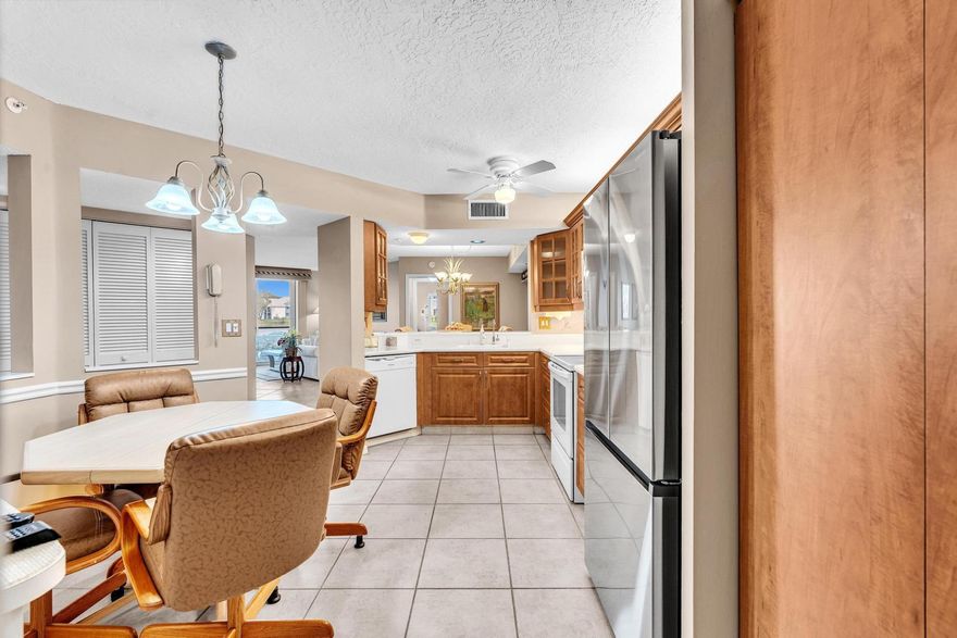 Rare Find** The larger Seagrape Model* Welcome to this beautifully updated, move-in-ready, lovely home located in the prestigious Weldon community of Kings Point in Tamarac! As you step onto your large, private front patio, you feel a warm invitation into your home, 2 bedrooms & 2 baths. It has a formal dining room & gorgeous, wide-open water views from both bedrooms, living room, the kitchen, & the dining room. Fabulous, featuring a large, open, magnficent upgraded kitchen with granite countertops & a spacious breakfast area. New stainless fridge. Beautiful Tile flooring throughout the living area, newer carpet in the bedrooms. Both bathrooms are upgraded tastefully. Impact windows and sliding doors leading to your screened patio, plus acrylic sliding door to prevent rain from coming in.  Ample open layout & a beautiful split floor plan offer a comfortable living experience. The master suite features spacious walk-in closets, light & bright. 24/7 Security at the gate. Enjoy the amenities of the Kings Point Community, including a state-of-the-art performing arts theater, a courtesy Shuttle, indoor and outdoor pools, a Gym, a Clubhouse, a pickleball court, Tennis Courts, shuffleboard, and a billiards room. There are also Arts and craft classes, a card room, shows, and much more.